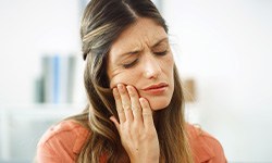 Closeup of woman experiencing toothache