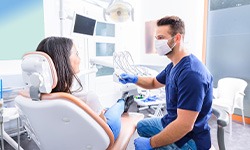 Dentist and patient talking in dental office