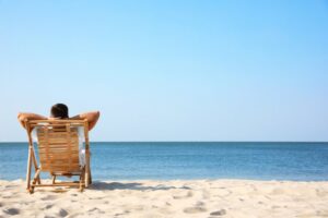 Man relaxing in beach chair at the beach